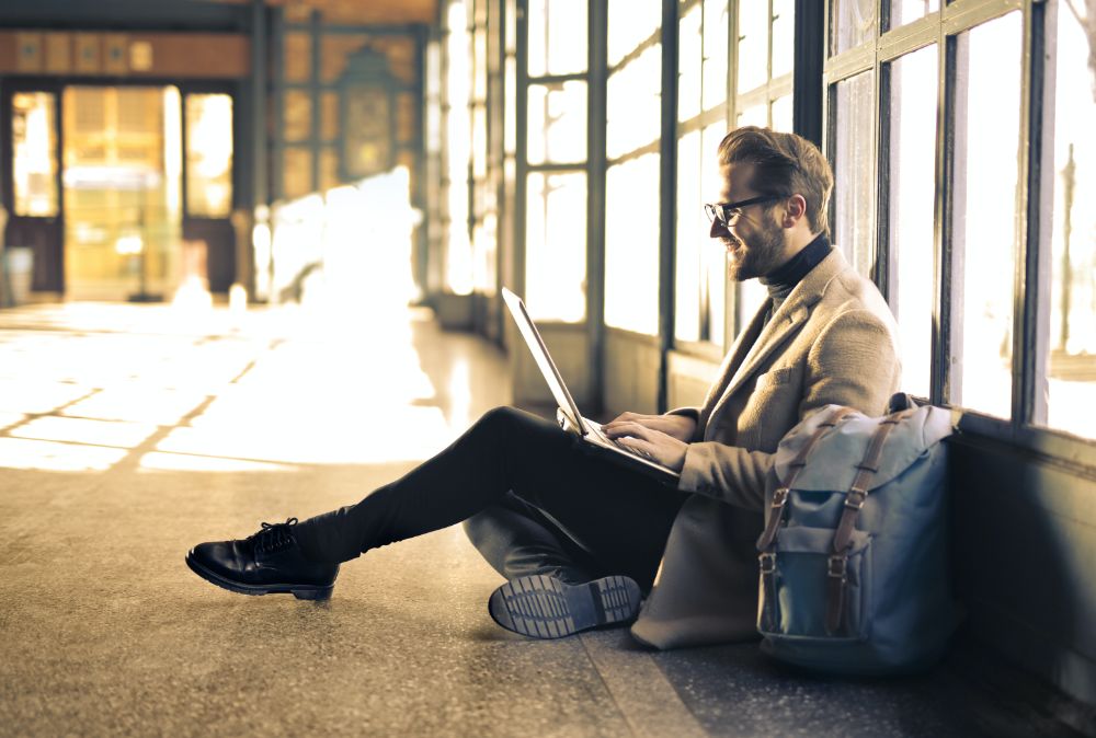 A person working on a laptop, setting up an affiliate marketing business