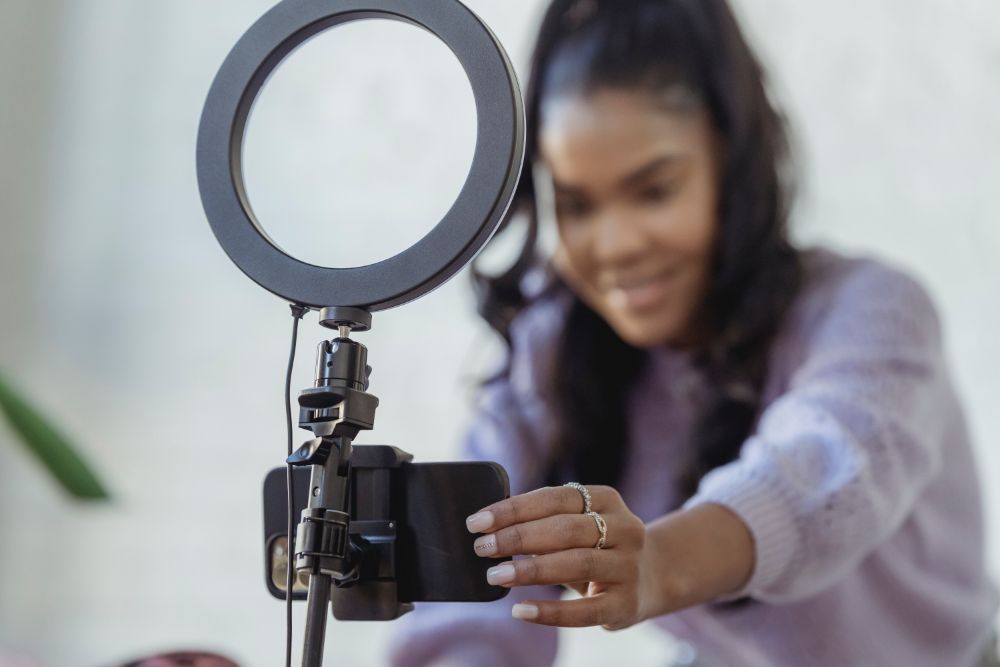 Influencer with light ring recording content